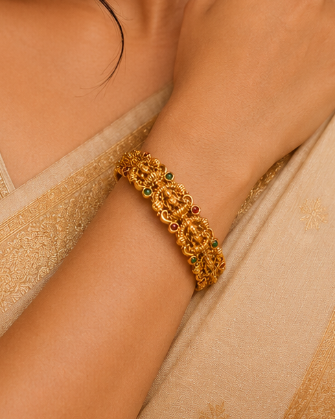 Antique Gold Lakshmi Deity Ribbed Oval Frame Bangle with Ruby Emerald Kemp | ONK39