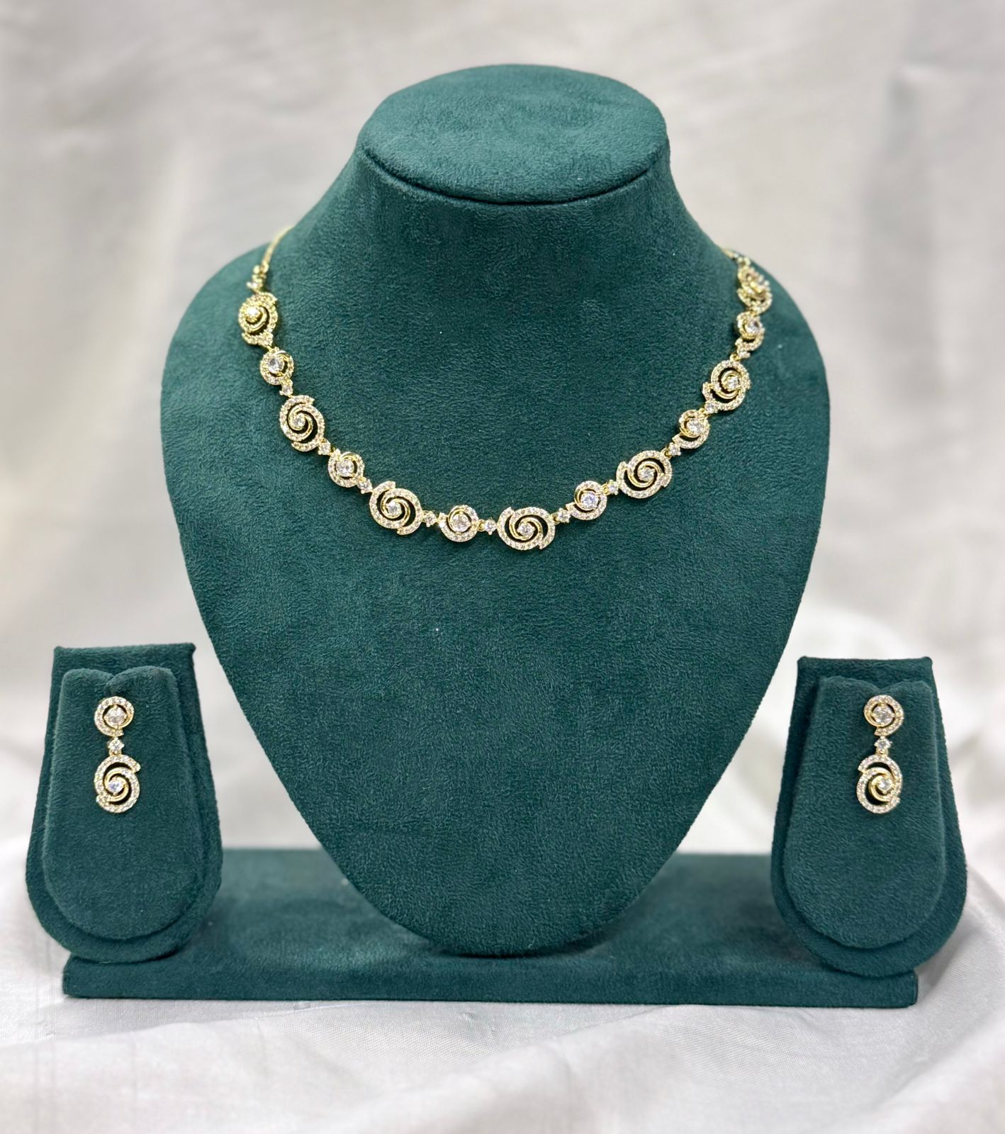 Elegant Gold Finish Spiral Design Necklace Set with Diamond Look Stones,llb427
