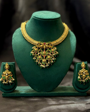 Antique Gold Plated Peacock Temple Necklace Set with Green & Ruby Stones, Pearl Drops and Matching Earrings | NVK2426