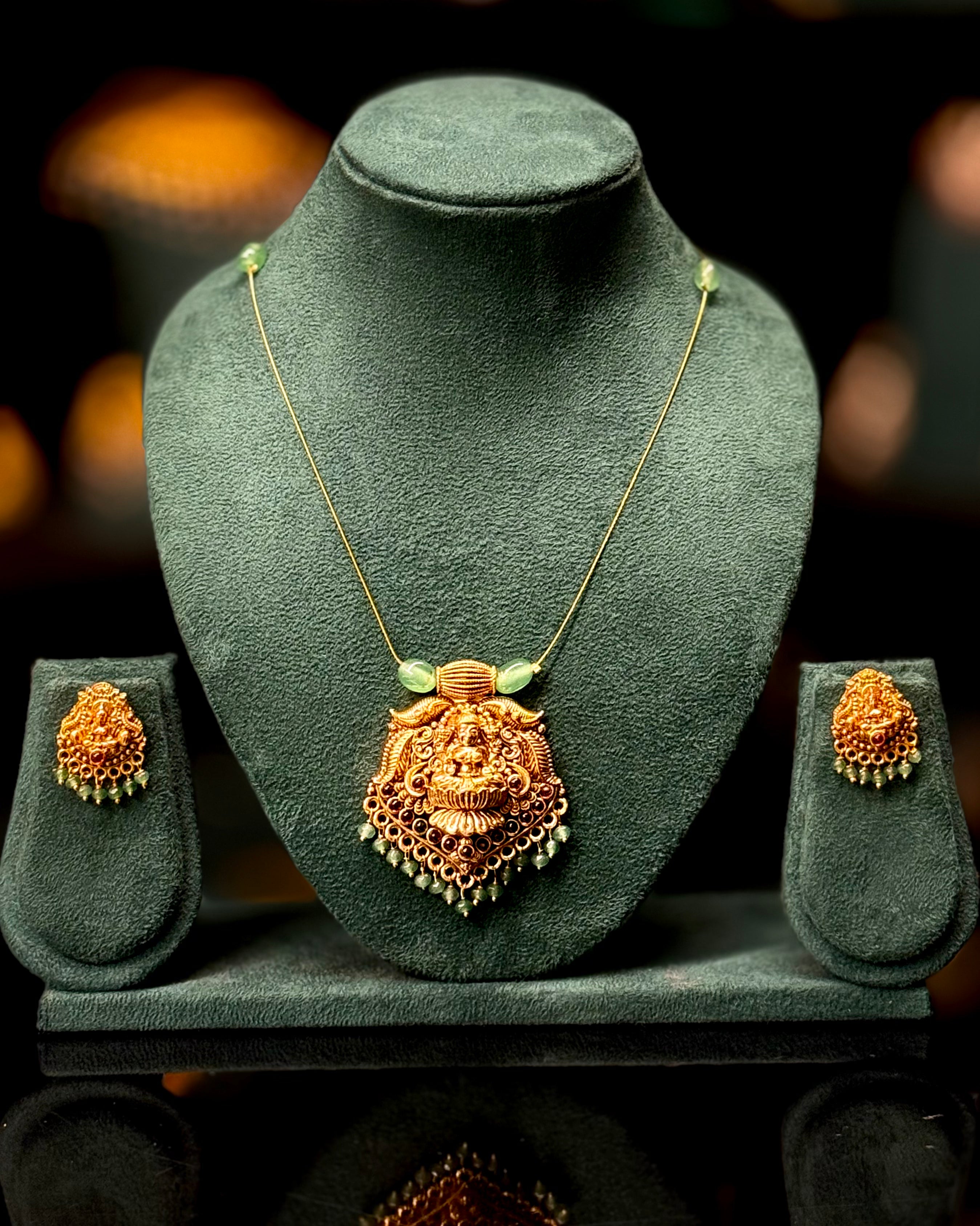 Antique Gold Lakshmi Pendant Necklace Set with Green Beads | ONK351