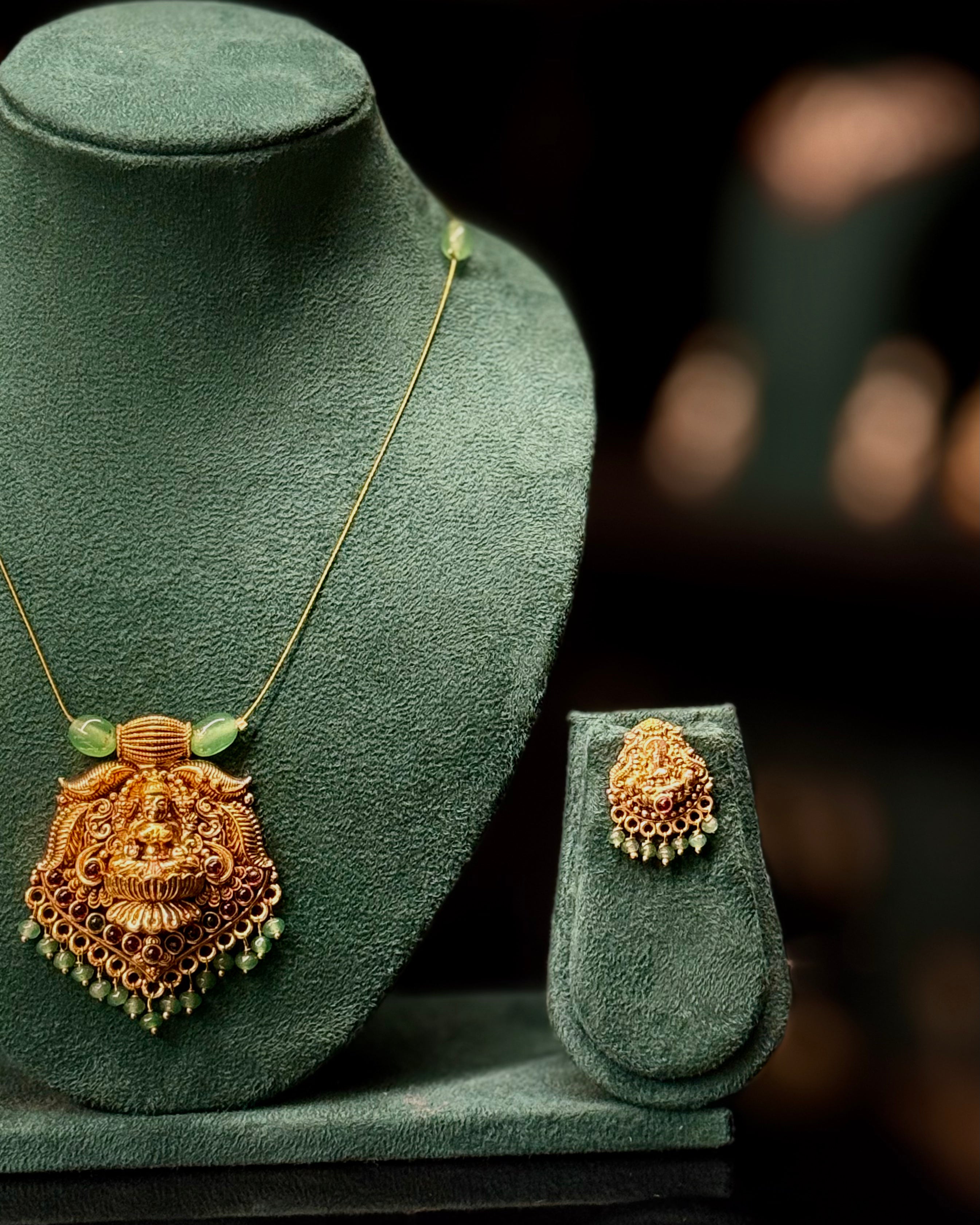 Antique Gold Lakshmi Pendant Necklace Set with Green Beads | ONK351