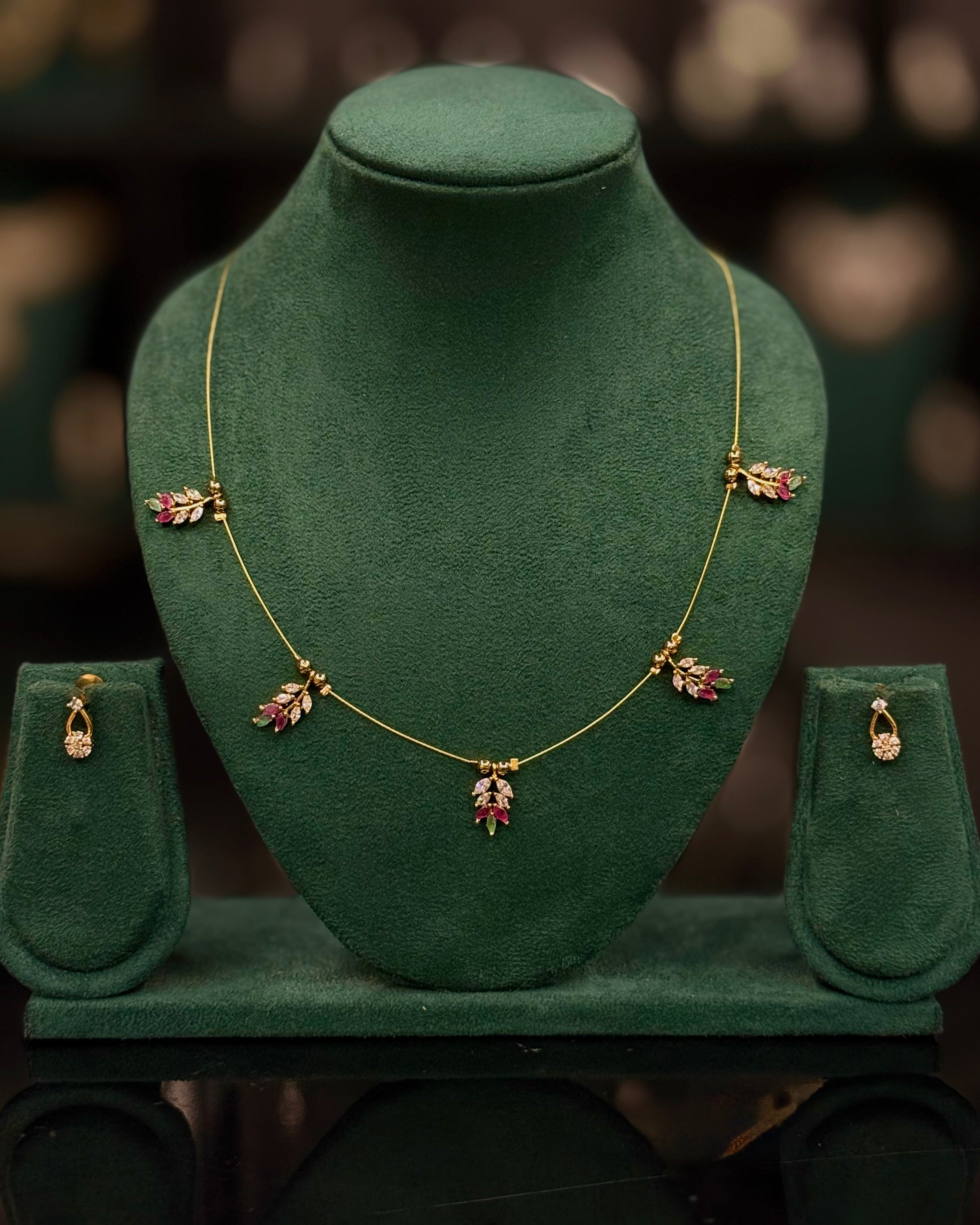 Elegant Gold Leaf Necklace Set with Pink & White Stones | ONK374