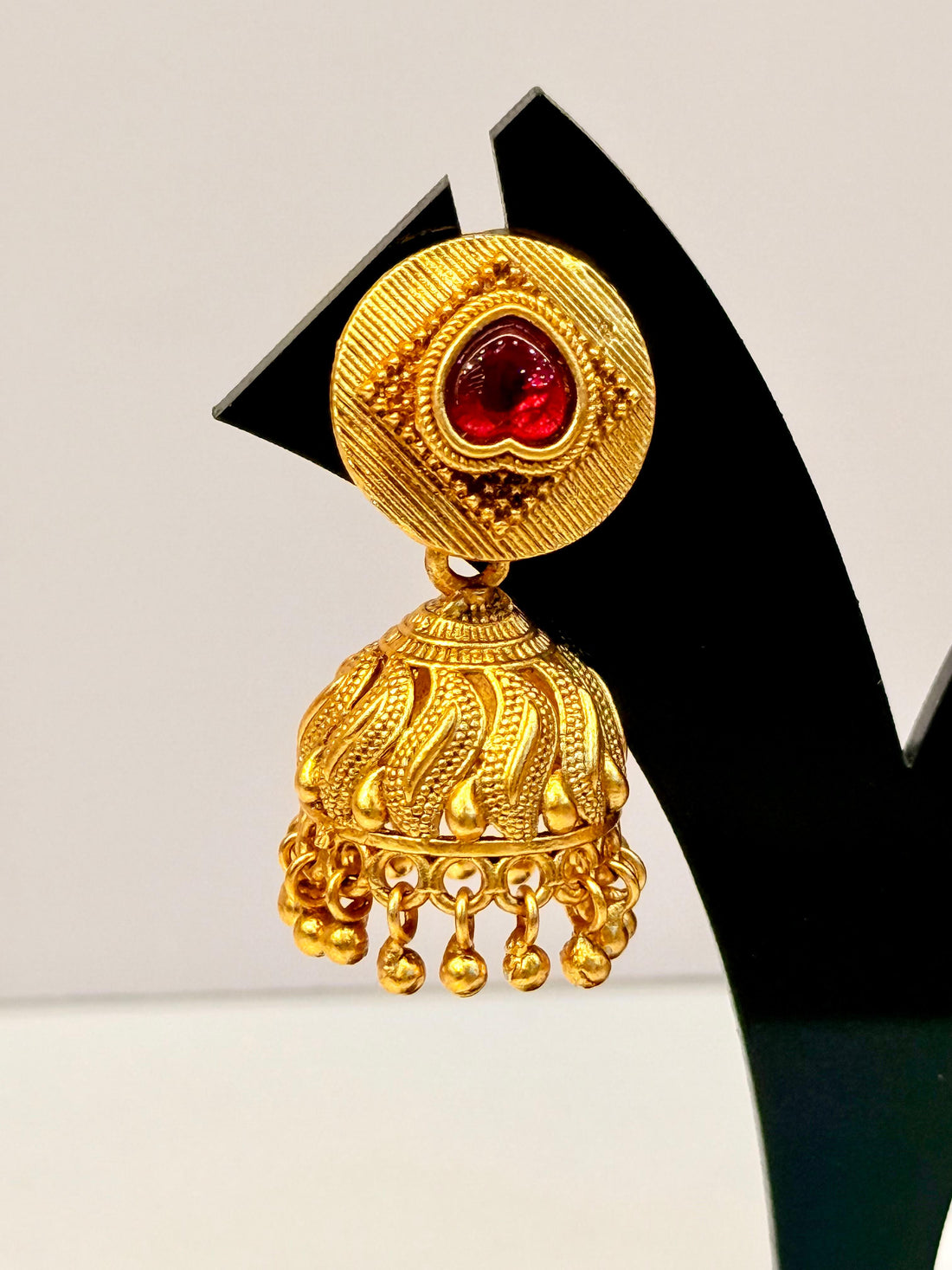 Antique Gold-Plated Jhumkas with Red Stone