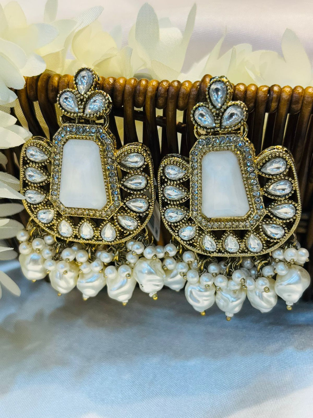 Earrings with White stone 