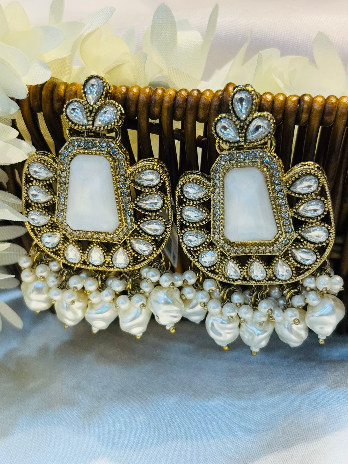 Earrings with White stone 