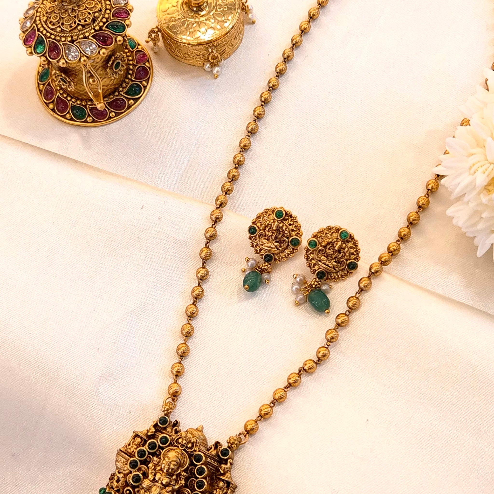 Gold temple jewelry set with Green stones and pearl drops
