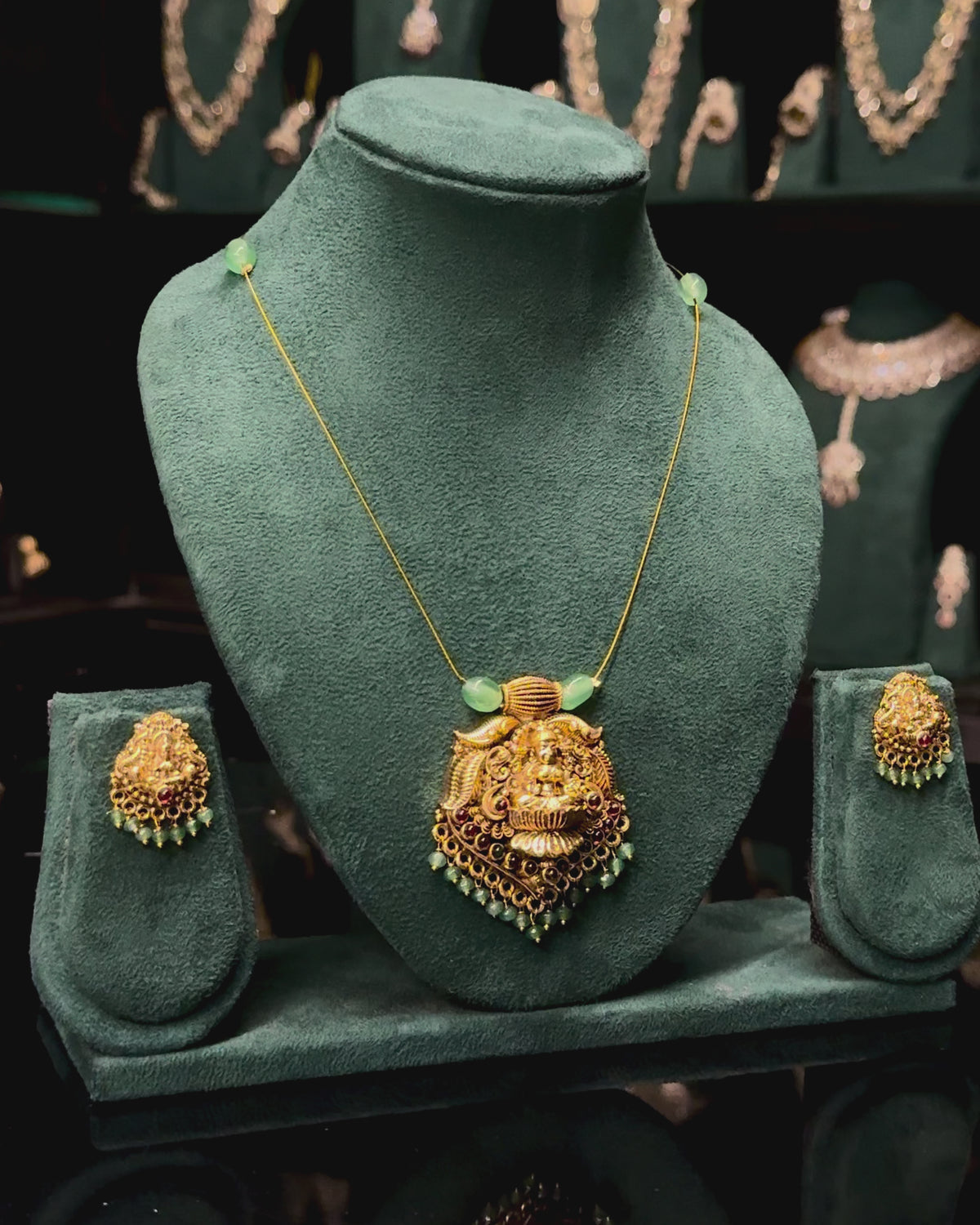 Antique Gold Lakshmi Pendant Necklace Set with Green Beads | ONK351